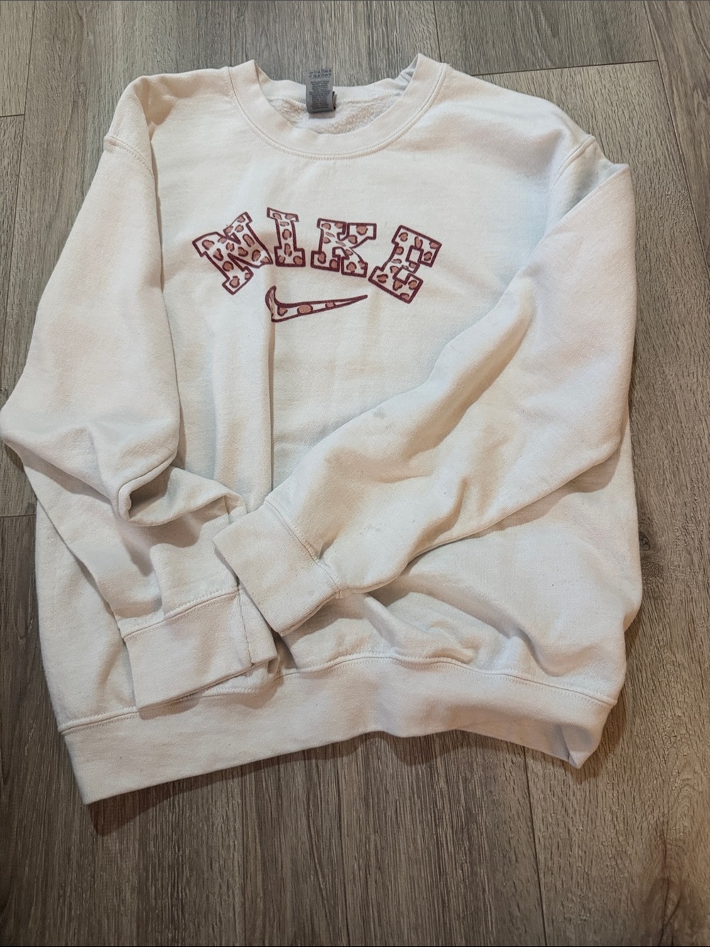 Nike White Crewneck Sweatshirt with Maroon Leopard Logo